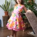 Платье для девочки нарядное БУШОН ST30, стиляги цвет розовый/желтый пояс бирюзовый, принт цветы